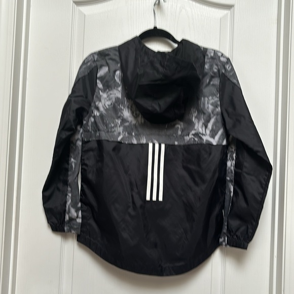 Adidas light rain coat with a zip up front and hood - Picture 3 of 4